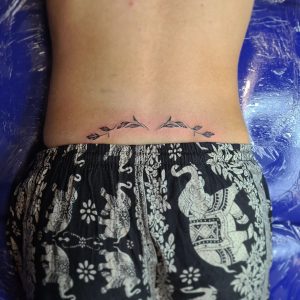 Lower back tattoo designs for women and men with meaning, flowers, and ...